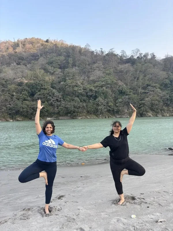 Partner Tree Pose Vrikshasana Balance on Ganges Beach
